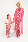 A woman and a young girl holding hands, both wearing matching Let Me Lounge Set - Distinguished Doggies with Hamptons Hot Pink pajamas in a red-and-white striped dog print.