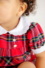 Toddler wearing a Mary Baker Bubble - Society Prep Plaid with Worth Avenue White romper featuring a white scalloped collar and cuffs, and two small white buttons on the bodice.