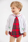 A toddler wearing a Barr Clay Bubble - Society Prep Plaid with Worth Avenue White & Richmond Red bubble romper under a white cardigan with holly leaf embroidery.