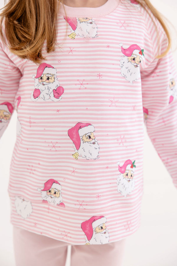 Cassidy Comfy Crewneck - Dear Santa (Palm Beach Pink Stripe) long-sleeved shirt featuring a white horizontal striped pattern with an all-over print of Santa Claus faces wearing pink hats.