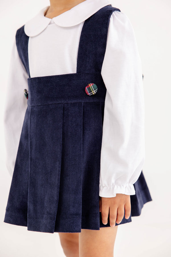 The Pearl Prep Skirt - Nantucket Navy Corduroy with Society Prep Plaid jumper worn over a white long-sleeved shirt with a Peter Pan collar.