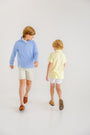 Prim & Proper Polo & Onesie - Lake Worth Yellow Stripe with Barbados Blue Stork