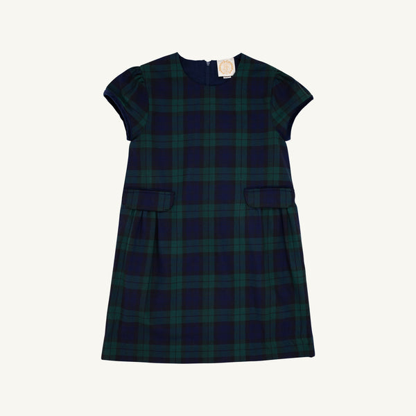 Betts Bow Dress - Berwick Black Watch with Nantucket Navy Velveteen Bows by The Beaufort Bonnet Company, a short-sleeved plaid dress with two small front pockets and a dark green and navy blue Berwick Black Watch checkered pattern, shown against a plain white background.