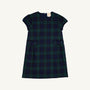 Betts Bow Dress - Berwick Black Watch with Nantucket Navy Velveteen Bows by The Beaufort Bonnet Company, a short-sleeved plaid dress with two small front pockets and a dark green and navy blue Berwick Black Watch checkered pattern, shown against a plain white background.