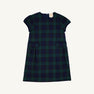 Betts Bow Dress - Berwick Black Watch with Nantucket Navy Velveteen Bows by The Beaufort Bonnet Company, a short-sleeved plaid dress with two small front pockets and a dark green and navy blue Berwick Black Watch checkered pattern, shown against a plain white background.