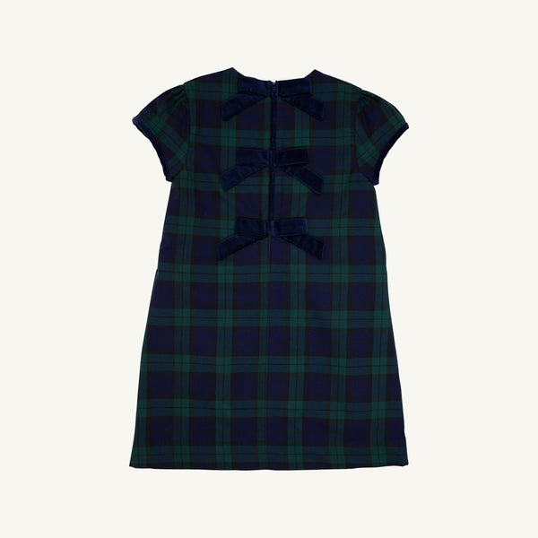 The Beaufort Bonnet Company’s Betts Bow Dress features a green and navy plaid Berwick Black Watch pattern and is accented with three Nantucket Navy velveteen bows down the back.