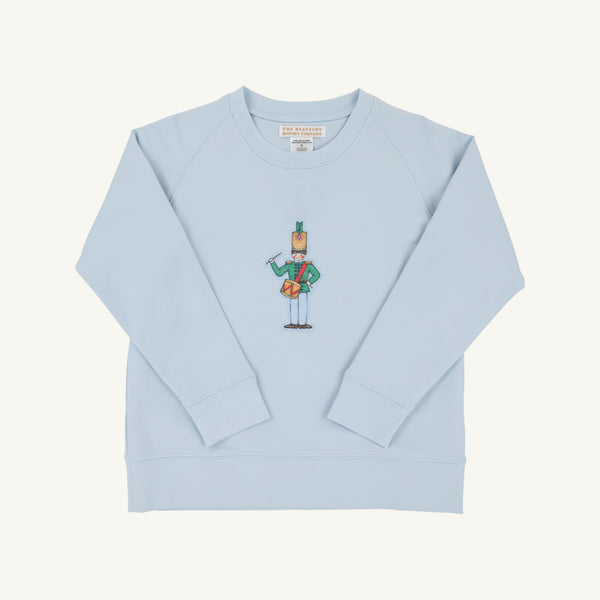 The Cassidy Comfy Crewneck by The Beaufort Bonnet Company features a charming “Drummer Boy” cartoon graphic on the front center and comes in a soft Buckhead Blue. This cozy sweatshirt has long sleeves and a classic crew neckline, making it perfect for everyday comfort.