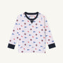 The Beaufort Bonnet Company’s Ole Miss Cassidy Comfy Crewneck - Gawsh Almighty with Nantucket Navy is a white long-sleeve kids’ sweatshirt featuring navy cuffs and collar, patterned with small blue pennants, circular emblems, and red “Cubs” text throughout the fabric.