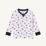 The Beaufort Bonnet Company’s Ole Miss Cassidy Comfy Crewneck - Gawsh Almighty with Nantucket Navy is a white long-sleeve kids’ sweatshirt featuring navy cuffs and collar, patterned with small blue pennants, circular emblems, and red “Cubs” text throughout the fabric.