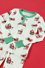 Sutton’s Sweet Dream Set - Serious Santa Business by The Beaufort Bonnet Company features playful Santa Claus and reindeer illustrations on a red background, complete with festive green cuffs and buttons, all crafted in cozy Pima cotton for the perfect Christmas pajama set.