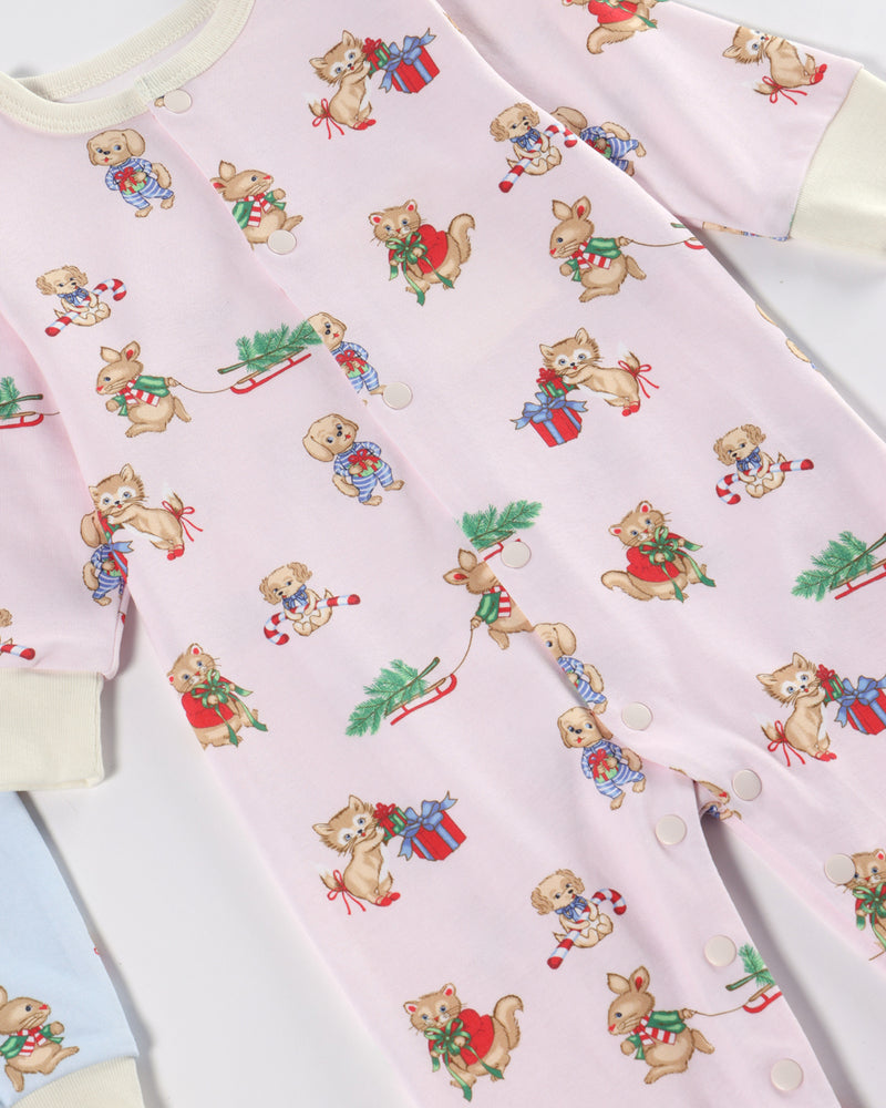 Wrap your little one in holiday cheer with the Paxton Playsuit - Christmastime Cuties (Belwood Blush) with Palmetto Pearl by The Beaufort Bonnet Company. This cozy pink playsuit features a whimsical print of cartoon cats, dogs, and squirrels all decked out in festive Christmas outfits—holding candy canes, presents, and wreaths. Made from ultra-soft Pima Cotton, it’s finished with convenient snap buttons and creamy Palmetto Pearl cuffs for ultimate comfort.