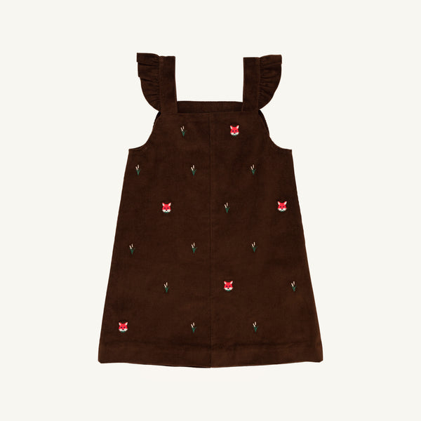 The Beaufort Bonnet Company Critter Julia Jumper in Chelsea Chocolate corduroy features ruffled shoulder straps and delightful fox embroidery with red fox faces and tiny green plants, shown against a white background.