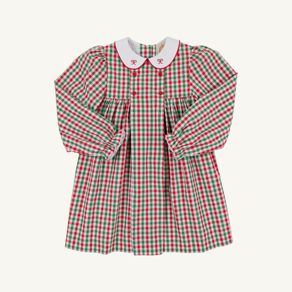 Introducing the Della Marie Dress in Richmond Red & Kiawah Kelly Green Gingham by The Beaufort Bonnet Company. This girls’ holiday dress features a charming red, green, and white plaid pattern with a gathered waist and a classic white collar adorned with sweet red bows—perfect for festive occasions this Christmas season.