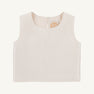 The Grandccasion™ Tessa Top by The Beaufort Bonnet Company is a sleeveless, cropped taffeta top in Grand Isle Ivory. Featuring a round neckline and smooth fabric, it is shown laid flat on a plain background, with a tag bearing a gold design visible near the collar.