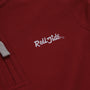 A close-up of The Beaufort Bonnet Company Alabama Hayword Half-Zip in Alabama Crimson with Alabama Grey and Worth Avenue White, featuring “Roll Tide” embroidered in white thread and a gray drawstring visible on the left—perfect for game day layering.