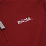 Close-up of The Beaufort Bonnet Company’s Alabama Hayword Half-Zip in Alabama Crimson with Alabama Grey and Worth Avenue White, featuring “Roll Tide” embroidered in white cursive letters—perfect for game day layering. A portion of the light gray drawstring is visible on the left side of the image.