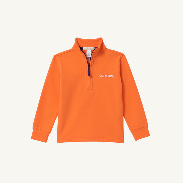 Clemson Hayword Half-Zip by The Beaufort Bonnet Company in vibrant Clemson Orange with Clemson Purple and Worth Avenue White accents. This long-sleeve pullover features a stand-up collar and a purple zipper pull. The left chest is embroidered with white “CLEMSON” text, making it the perfect layering piece for game day. Shown laid flat on a plain light background.