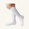 A person is wearing a pair of Jefferies High Class Knee Socks in White from The Beaufort Bonnet Company. Only the lower legs and feet are visible against a plain light background, creating a timeless look for girls or boys that perfectly complements any T.B.B.C. outfit.
