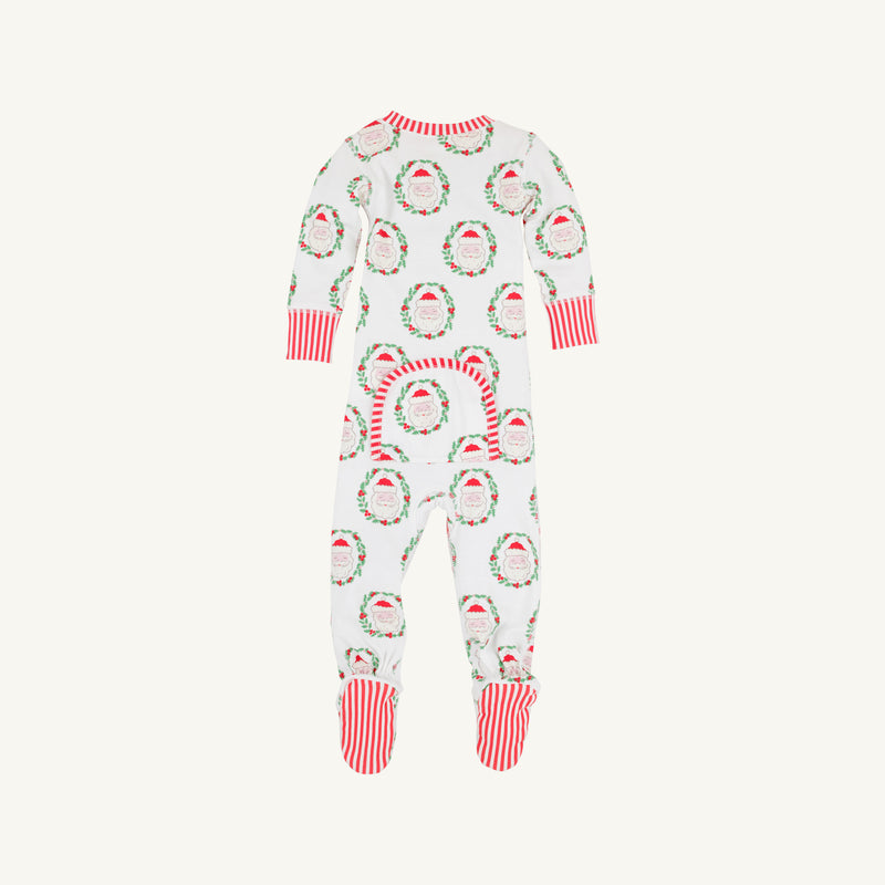 Introducing the Knox’s Night Night - North Pole Portrait with Richmond Red Stripe by The Beaufort Bonnet Company: a white baby onesie featuring festive Santa faces and wreaths, finished with vibrant red cuffs and feet. Cheerful red and white stripes accent the feet, while a small back flap in matching print adds an extra adorable detail.