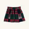 A McPrimm Party Skirt - Mercer Island Madras, featuring a pleated design with a patchwork pattern of red, green, and navy plaid fabric.