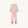 The Beaufort Bonnet Company’s Noelle’s Night Night - Gourd-geous (Palmetto Pearl) with Palm Beach Pink is a cozy waffle knit one-piece girls’ pajama laid flat on a white background. These white footed pajamas feature pink cuffs, matching pink soles, an all-over pink pomegranate-inspired print, and a pink-trimmed flap on the back.