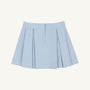 The Parson Pleated Skirt in Buckhead Blue Corduroy by The Beaufort Bonnet Company is a light blue corduroy mini skirt featuring pleats, a front zipper, and a waistband, displayed against a plain white background.