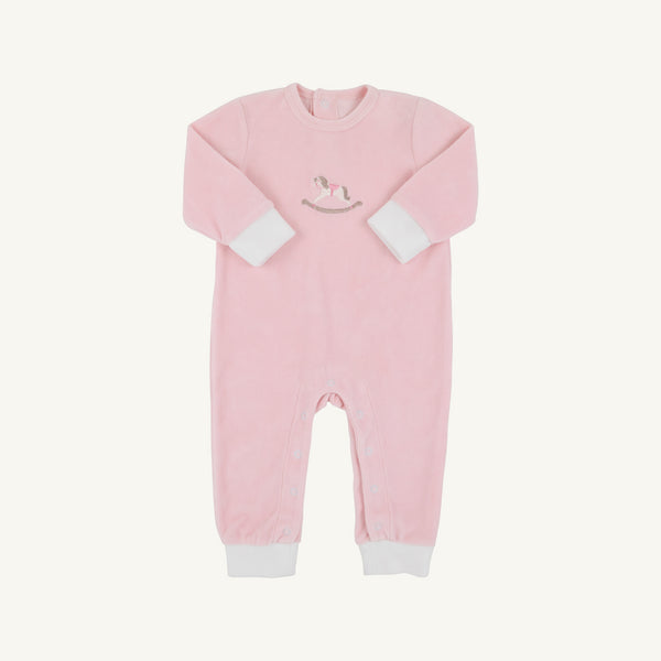 The Beaufort Bonnet Company’s Paxton Playsuit in Palm Beach Pink features crisp white cuffs, a charming rocking horse embroidery on the chest, and convenient leg snaps for easy changing.