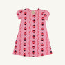 Penny’s Play Dress - Ladybug Line Up by The Beaufort Bonnet Company: A pink short-sleeve dress adorned with a charming pattern of red and black ladybugs and small red leaves, crafted from soft Pima Cotton and displayed on a white background.