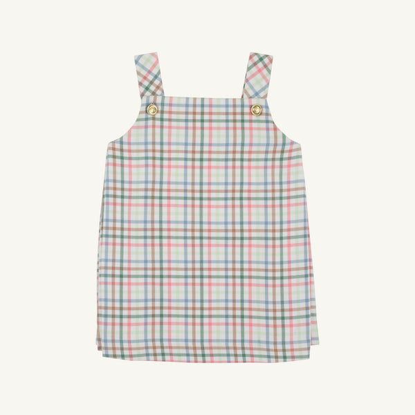 The Beaufort Bonnet Company’s Pleated Ginny Jumper in Manalapan Plaid features an A-line, sleeveless silhouette with shoulder straps and gold buttons, showcasing a pastel pink, blue, and green plaid—perfect for fall styling and displayed on a simple background.