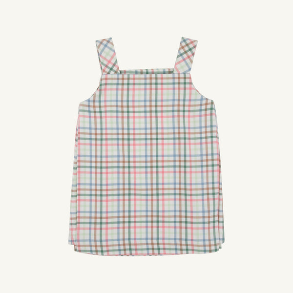 The Beaufort Bonnet Company’s Pleated Ginny Jumper in Manalapan Plaid, a sleeveless dress with thick shoulder straps featuring a pastel pink, green, blue, and white plaid pattern, is displayed laid flat on a plain background.