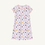 The LSU Polly Play Dress - Tenacious Tigers with Palm Beach Pink by The Beaufort Bonnet Company is a short-sleeved, light pink children’s dress made from soft Pima Cotton Knit, featuring all-over prints of pennants, teddy bears, and milk bottles in various colors, and finished with pink trim on the collar and sleeves.