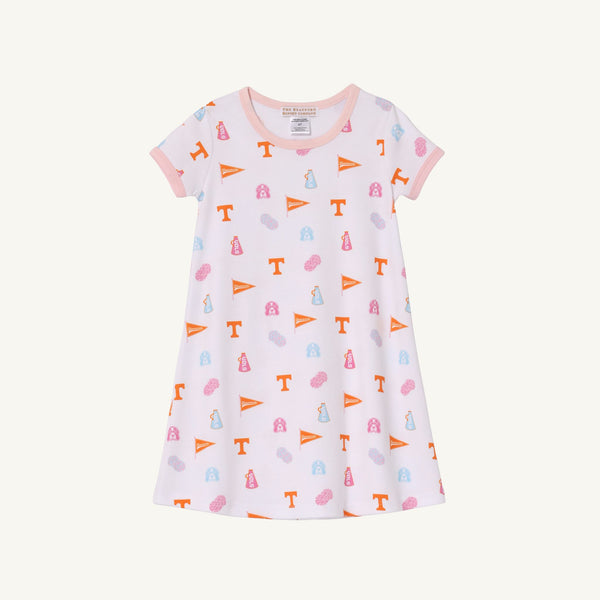 Introducing the Tennessee Polly Play Dress - Victory in Orange with Palm Beach Pink by The Beaufort Bonnet Company: a short-sleeved, white dress crafted from soft Pima Cotton Knit, featuring peach trim and decorated with repeating orange flags, pink and blue icons, and orange T letters for a winning look.