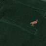 Close-up of a dark green corduroy pocket from The Beaufort Bonnet Company’s Prep School Pants in Grier Green, featuring a small embroidered Gray Bay Brown stork logo above the pocket.