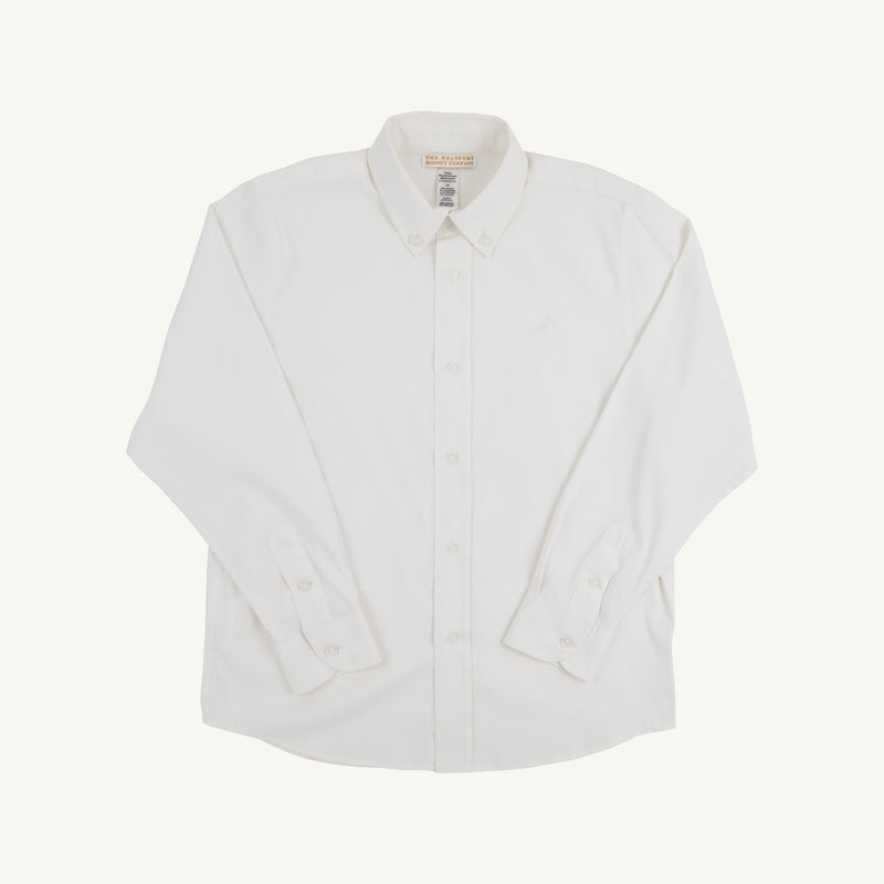 The Prepletic™ Dean’s List Dress Shirt - Worth Avenue White by The Beaufort Bonnet Company is a plain white, long-sleeve, button-up boys’ dress shirt laid flat on a white background. This shirt features a button-down collar and cuff buttons, and is crafted from performance fabric to ensure all-day comfort.