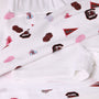 Show your South Carolina Spirit with The Beaufort Bonnet Company’s USC Searcy Skort - South Carolina Spirit with Worth Avenue White, featuring white fabric adorned with University of South Carolina logos, cheer megaphones, pom-poms, and red and garnet Carolina flags in overlapping layers. Perfect for custom creations or spirited game day style!.