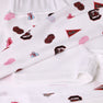 Show your South Carolina Spirit with The Beaufort Bonnet Company’s USC Searcy Skort - South Carolina Spirit with Worth Avenue White, featuring white fabric adorned with University of South Carolina logos, cheer megaphones, pom-poms, and red and garnet Carolina flags in overlapping layers. Perfect for custom creations or spirited game day style!.