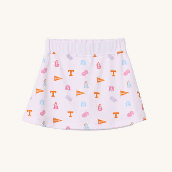 The Tennessee Searcy Skort - Victory in Orange with Worth Avenue White by The Beaufort Bonnet Company features a white background adorned with orange, blue, and pink University of Tennessee-themed icons—including T logos, pennants, pom-poms, and megaphones—making it the perfect choice for your next gameday outfit.