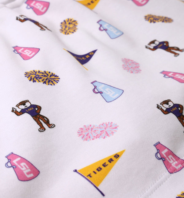 Made from white Pima cotton fabric, the LSU Searcy Skort - Tenacious Tigers with Worth Avenue White by The Beaufort Bonnet Company features a playful Tenacious Tigers print with cartoon LSU mascots, purple and gold pom-poms, megaphones, and a gold pennant reading “TIGERS” in repeating shades of purple, gold, blue, and pink—perfect for showing your school spirit.