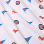 Crafted from white Pima cotton, the Ole Miss Short Sleeve Patton Play Bubble - Gawsh Almighty with Nantucket Navy by The Beaufort Bonnet Company features a repeating design of blue pennants, red “Ole Miss” text, and round University of Mississippi logos in red and white across the fabric.