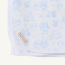 The Sir Proper’s Sweet Arrival (Beale Street Blue) Accessories Bundle by The Beaufort Bonnet Company includes a baby buggy blanket made from white Pima cotton, adorned with light blue animal and nature illustrations and finished with a corner sewn label featuring THE BEAUFORT BONNET COMPANY in gold lettering—an ideal choice for baby shower gifts or adding to your baby registry.