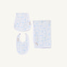 The Beaufort Bonnet Company’s Sir Proper’s Sweet Arrival (Beale Street Blue) Accessories Bundle is pictured, featuring a Baby Buggy Blanket, Oopsie Daisy Burp Cloth, and Burp Me Bib—all crafted in soft white fabric with a light blue animal print pattern and arranged on a white background. This charming set makes an ideal choice for baby shower gifts or to add to your baby registry.