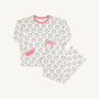The Beaufort Bonnet Company’s Snooze Button Set – North Pole Portrait with Richmond Red Stripe features a white long-sleeve pajama top adorned with festive Christmas wreath prints and finished with red-striped cuffs and collar. The coordinating pants, displayed flat on a light background, have a comfortable drawstring waist and matching wreath pattern.