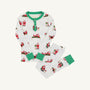 Sutton’s Sweet Dream Set – Serious Santa Business by The Beaufort Bonnet Company is a children’s white Pima cotton pajama set featuring green cuffs and collar, adorned with playful illustrations of Santa Claus in various poses. This festive holiday sleepwear includes a long-sleeve top and matching long pants, shown flat on a light background—perfect Christmas pajamas for kids.