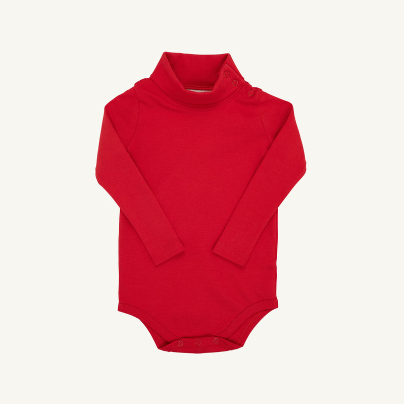 Introducing Tatum’s Turtleneck & Onesie (Unisex) in Richmond Red by The Beaufort Bonnet Company: a long-sleeved baby bodysuit made from soft Pima Cotton, featuring a cozy turtleneck and convenient snap buttons at the shoulder and bottom for easy changing, displayed on a plain white background.