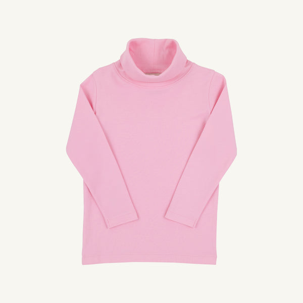 Tatum’s Turtleneck & Onesie - Pier Party Pink by The Beaufort Bonnet Company, a soft and comfortable long-sleeved turtleneck for children, is laid flat on a plain white background to highlight its charming light pink design.