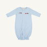 Introducing the Twinkle Twinkle 2-in-1—Buckhead Blue with Trains by The Beaufort Bonnet Company. Crafted from soft Pima cotton, this charming layette features a light blue hue, long sleeves, front snap buttons, and an elasticized bottom for easy changing. A delicate embroidered train motif spans the chest, adding a touch of classic charm. Perfect for your little one—all set against a plain white background.
