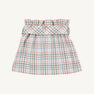 The Beasley Bow Skirt - Manalapan Plaid by The Beaufort Bonnet Company is a pastel plaid skirt featuring a gathered, ruffled waistband and a wide matching belt. Showcasing the signature Manalapan Plaid pattern for a light, summery look, this piece is presented on a plain, off-white background.