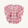 The Beaufort Bonnet Company Bradley Bubble - Broadway Play Plaid with Worth Avenue White romper features a pink, red, and white plaid pattern, a white lace-trimmed collar, and two small white bows on the chest.