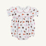 The Auburn Britt Bubble - Tiger Thrill with Hamptons Hot Pink by The Beaufort Bonnet Company is a white baby romper featuring puff sleeves, a Peter Pan collar, and a colorful Auburn University-themed Tiger Thrill print with pennants, pom-poms, hearts, and tiger mascots. Crafted from soft Pima Cotton Knit, it includes convenient snap closures at the bottom.