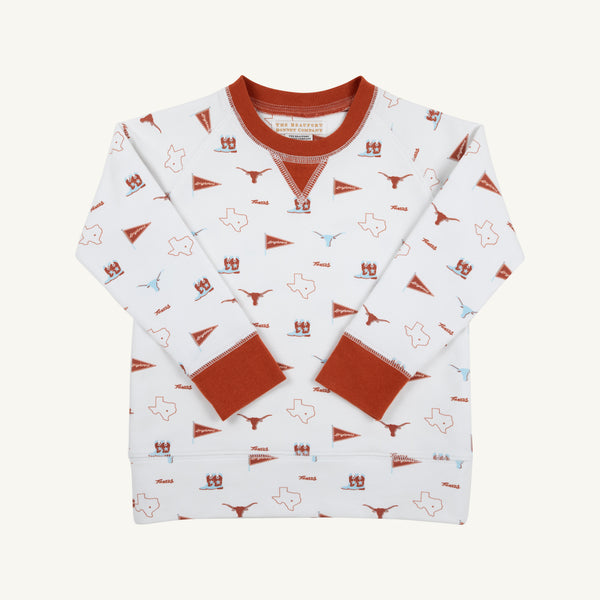 The Beaufort Bonnet Company’s Texas Cassidy Comfy Crewneck - Gone to Texas with Texas Orange is a white children’s sweatshirt featuring burnt orange cuffs, collar, and hem. It showcases playful Texas-themed icons—including state outlines, longhorns, pennants, and helmets in burnt orange and blue—making it the perfect cozy piece for displaying Lone Star State pride.